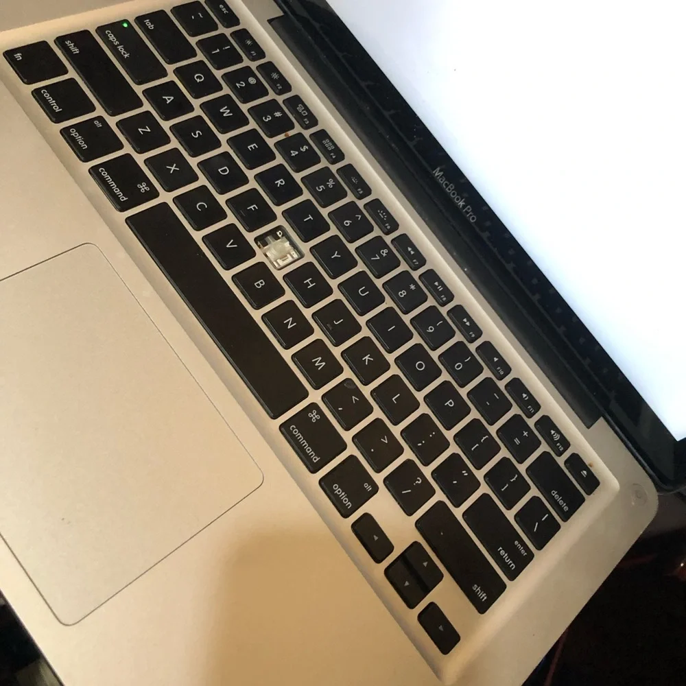 Apple MacBook with 4 chargers and dell laptop for parts